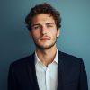 man-with-curly-hair-white-shirt-is-posing-photo_916191-430731